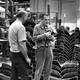 Richard Donges and Charles Eames at the Herman Miller factory.